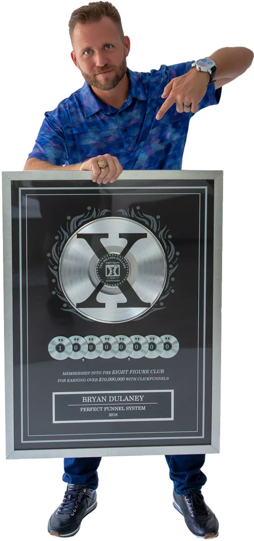 Bryan Dulaney holding his ClickFunnels Two Comma Club X award for Perfect Funnel System
