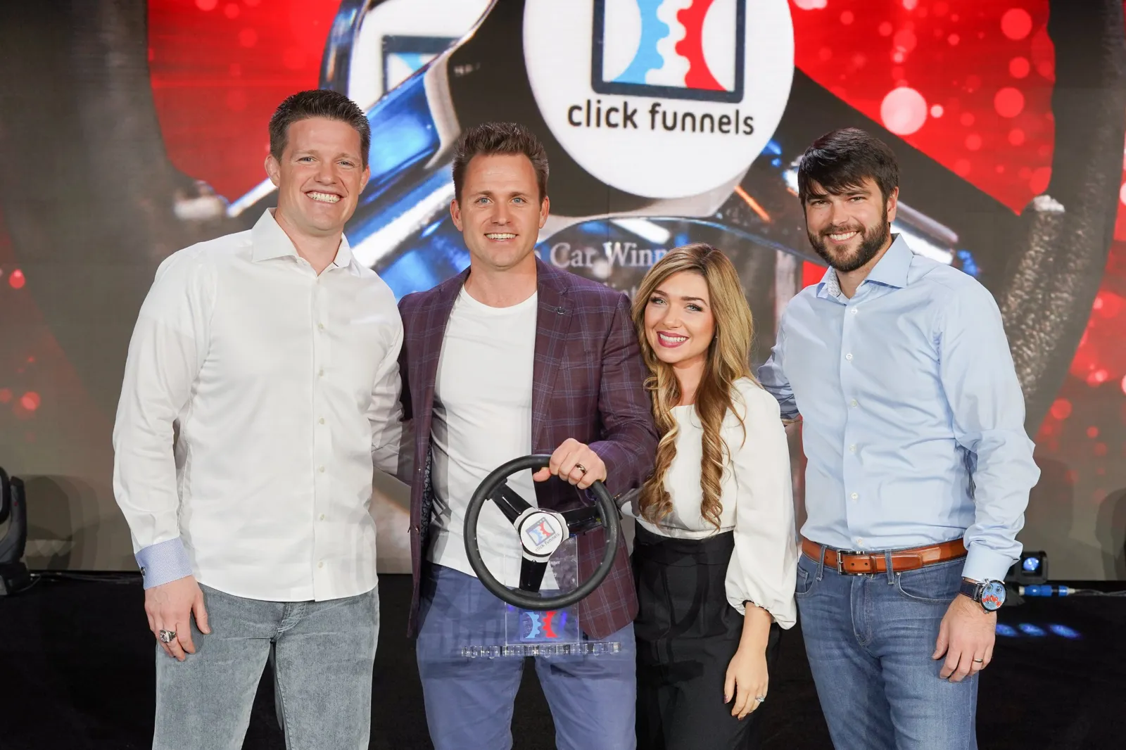 Bryan and Stephanie Dulaney receiving a ClickFunnels car winner award