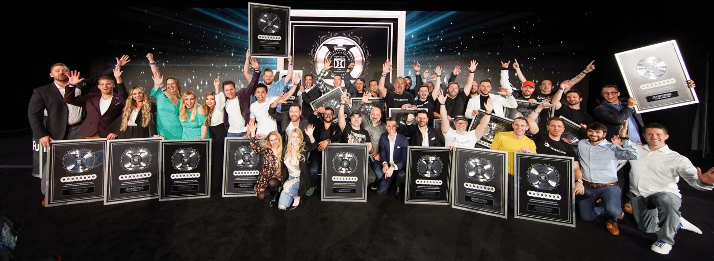 ClickFunnels Two Comma Club X award winners on stage